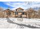 Charming brick home exterior in winter with snowy front yard at 2222-2224 Hooker St, Denver, CO 80211