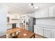 Bright kitchen with stainless steel appliances, white cabinets, and hardwood floors at 2222-2224 Hooker St, Denver, CO 80211