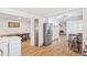 Spacious kitchen featuring white cabinets, stainless steel appliances, and light hardwood floors at 2222-2224 Hooker St, Denver, CO 80211