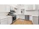 Modern kitchen with white cabinetry, stainless steel appliances, and ample counter space at 2222-2224 Hooker St, Denver, CO 80211