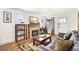Cozy living room with fireplace, exposed beams, and wood flooring at 2222-2224 Hooker St, Denver, CO 80211