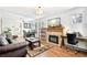 Spacious living room with fireplace, desk area and open to the dining area at 2222-2224 Hooker St, Denver, CO 80211