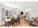 Open-concept living room and dining room filled with light and charm at 2222-2224 Hooker St, Denver, CO 80211