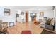 Open-concept living area featuring hardwood floors, a comfortable sofa, and seamless flow at 2222-2224 Hooker St, Denver, CO 80211