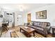 Bright living room with hardwood floors, leather sofa and wood trim at 2222-2224 Hooker St, Denver, CO 80211