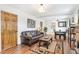 Inviting living room has hardwood floors, a leather sofa and wood doors at 2222-2224 Hooker St, Denver, CO 80211