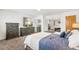 Comfortable main bedroom with tv, neutral carpet, and matching dressers at 2222-2224 Hooker St, Denver, CO 80211