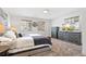 Comfortable main bedroom with tv, neutral carpet, and matching dressers at 2222-2224 Hooker St, Denver, CO 80211