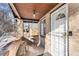 Charming covered porch with brick walls and a white door creates a welcoming entrance at 2222-2224 Hooker St, Denver, CO 80211