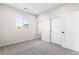 Minimalist bedroom with a window and a closet at 8903 Springsong Ln, Littleton, CO 80125