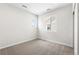 Bright bedroom with carpeted floors, a window, and neutral decor at 8903 Springsong Ln, Littleton, CO 80125
