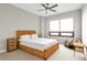 Bright bedroom featuring a woven platform bed with bedside tables and a large window at 2990 E 17Th Ave # 1102, Denver, CO 80206