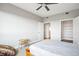 Spacious bedroom features neutral walls, ceiling fan, and a closet with ample storage space at 2990 E 17Th Ave # 1102, Denver, CO 80206