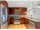 Updated kitchen with stainless steel appliances, granite counters, and stylish cabinetry at 2990 E 17Th Ave # 1102, Denver, CO 80206