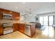 Open kitchen area flowing into the living space, featuring stainless steel appliances and granite countertops at 2990 E 17Th Ave # 1102, Denver, CO 80206