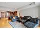 Spacious living room featuring hardwood floors, a leather sofa set, and modern decor at 2990 E 17Th Ave # 1102, Denver, CO 80206