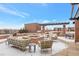 Elegant rooftop lounge featuring a fire pit, comfortable seating, and city views at 2990 E 17Th Ave # 1102, Denver, CO 80206