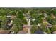 An aerial view shows a neighborhood with mature trees, well maintained lawns, and houses with driveways at 216 Hemlock, Broomfield, CO 80020