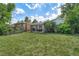 A lush, green backyard with a lawn, a patio with furniture, and a grill, perfect for entertaining at 216 Hemlock, Broomfield, CO 80020
