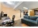Basement featuring a functional home office and a comfortable seating area at 216 Hemlock, Broomfield, CO 80020