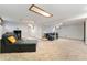 Finished basement offers a cozy living space with plush seating and bright lighting at 216 Hemlock, Broomfield, CO 80020