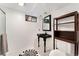 Modern bathroom features a sleek black vanity, stylish mirror, and updated fixtures at 216 Hemlock, Broomfield, CO 80020