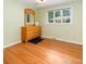 Bedroom with light green walls and hardwood floors at 216 Hemlock, Broomfield, CO 80020