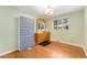 Bedroom with light green walls and hardwood floors at 216 Hemlock, Broomfield, CO 80020