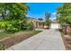 Charming brick home featuring a long driveway, attached garage, and well-manicured front yard at 216 Hemlock, Broomfield, CO 80020