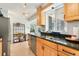 Bright kitchen featuring wooden cabinets, stainless steel appliances, and a window over the sink at 216 Hemlock, Broomfield, CO 80020