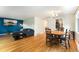 Open-concept living room and dining area featuring hardwood floors and abundant natural light at 216 Hemlock, Broomfield, CO 80020