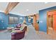 Finished basement with wood beam and columns, carpet, bar area, living area and open to another room at 8796 E 150Th Ct, Thornton, CO 80602