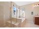 Luxurious primary bathroom with a large shower, soaking tub, and vanity at 8796 E 150Th Ct, Thornton, CO 80602