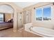 Elegant bathroom with a separate shower and luxurious tub at 8796 E 150Th Ct, Thornton, CO 80602