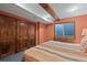Bedroom boasts wood beam, large closet and colorful striped comforter at 8796 E 150Th Ct, Thornton, CO 80602