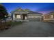 Charming single-story home with a covered front porch and an attached two-car garage at 8796 E 150Th Ct, Thornton, CO 80602