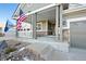 Inviting front porch with decorative columns, perfect for enjoying a morning coffee at 8796 E 150Th Ct, Thornton, CO 80602
