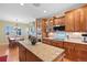 Bright kitchen with granite countertops, stainless appliances, and a cozy breakfast nook at 8796 E 150Th Ct, Thornton, CO 80602