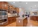 Modern kitchen with granite countertops, stainless appliances, and ample cabinet space at 8796 E 150Th Ct, Thornton, CO 80602