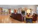 Open concept living room with hardwood floors and views to the kitchen at 8796 E 150Th Ct, Thornton, CO 80602