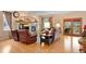 Inviting living room with a cozy fireplace, hardwood floors, and access to the backyard at 8796 E 150Th Ct, Thornton, CO 80602