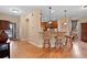 Open-concept living area and kitchen featuring breakfast bar, perfect for entertaining guests at 8796 E 150Th Ct, Thornton, CO 80602