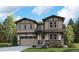 Two-story Craftsman style home with a large front yard and attached two-car garage at 8205 Cokedale Cir, Littleton, CO 80125