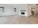 Spacious living room with a modern fireplace and hardwood floors at 8205 Cokedale Cir, Littleton, CO 80125