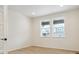 Bright room with two windows and light wood flooring, perfect for an office at 8205 Cokedale Cir, Littleton, CO 80125