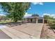 Charming home with stone accents and mature trees offers great curb appeal to the property at 1680 S Patton Ct, Denver, CO 80219
