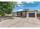 Charming single-story home with stone accents and a well-manicured front yard in a quiet neighborhood at 1680 S Patton Ct, Denver, CO 80219
