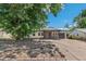 Charming home with stone accents and mature trees offers great curb appeal to the property at 1680 S Patton Ct, Denver, CO 80219