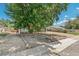 View of front yard with landscaping and mature trees providing shade and curb appeal to the property at 1680 S Patton Ct, Denver, CO 80219