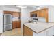 Well-equipped kitchen features stainless steel appliances and ample counter space at 1680 S Patton Ct, Denver, CO 80219